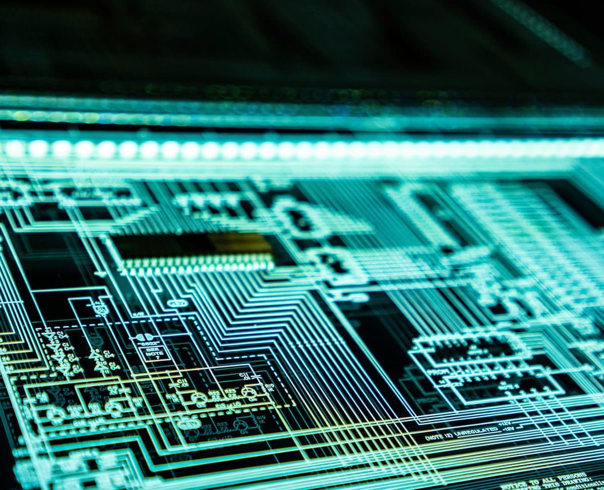Wide close-up of an illuminated circuit board